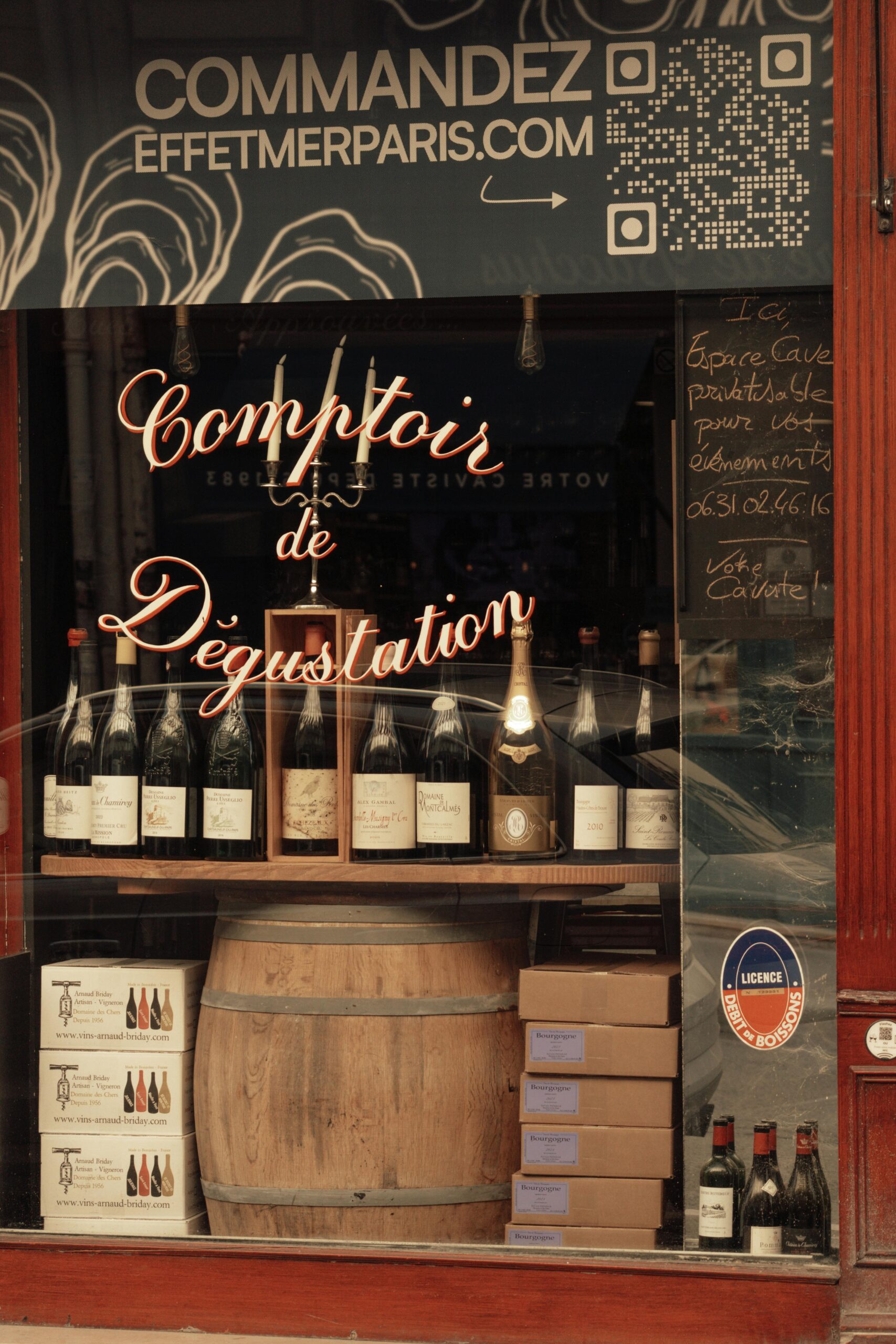 Charming Paris wine shop showcasing a variety of bottles, inviting ambiance.